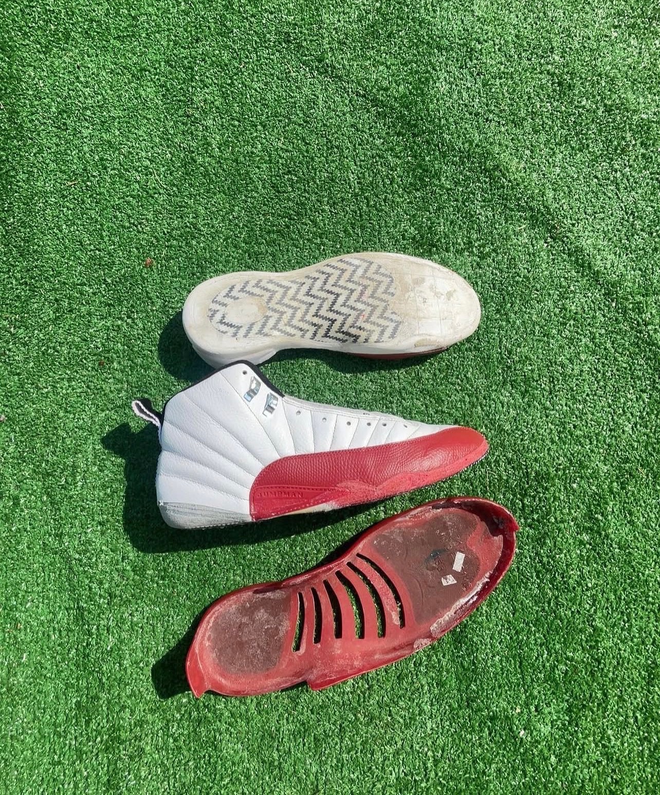 Jordan 12 Cherry with the red sole fully separated from the upper
