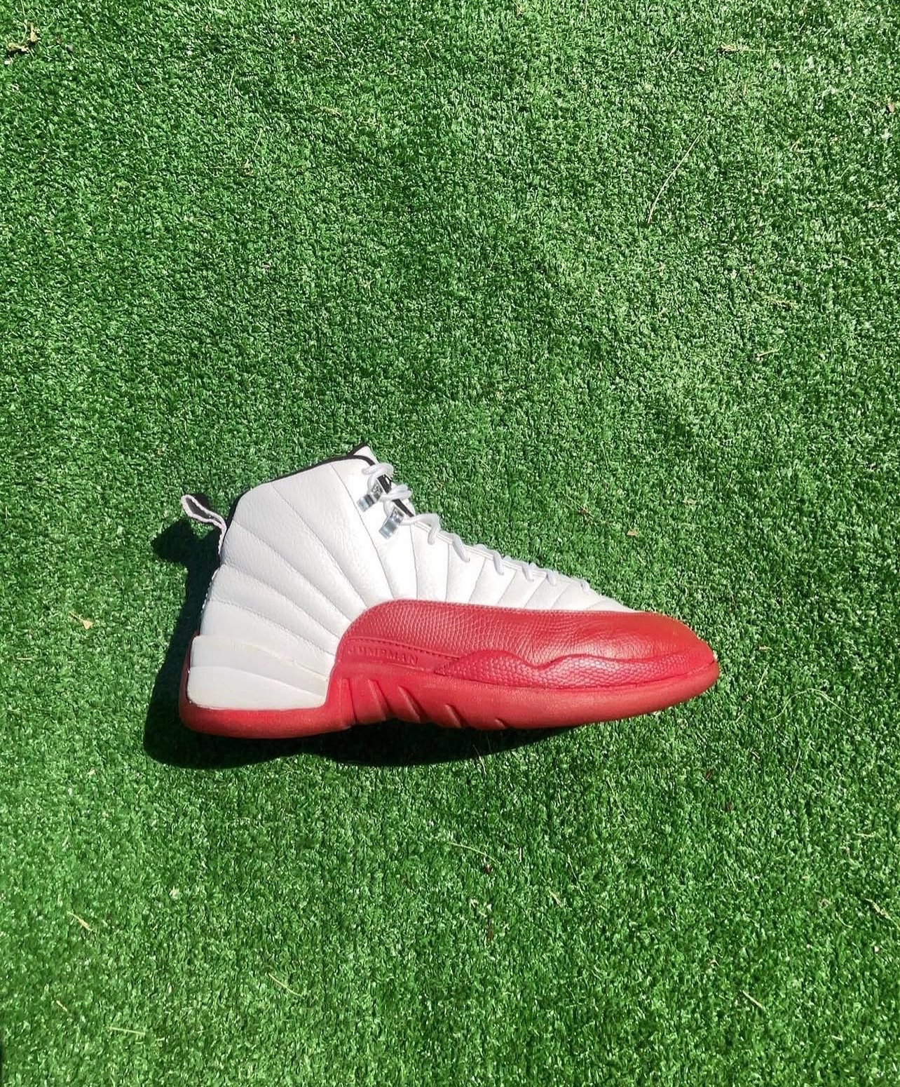 The same Jordan 12 Cherry rebuilt with a clean red sole and white leather